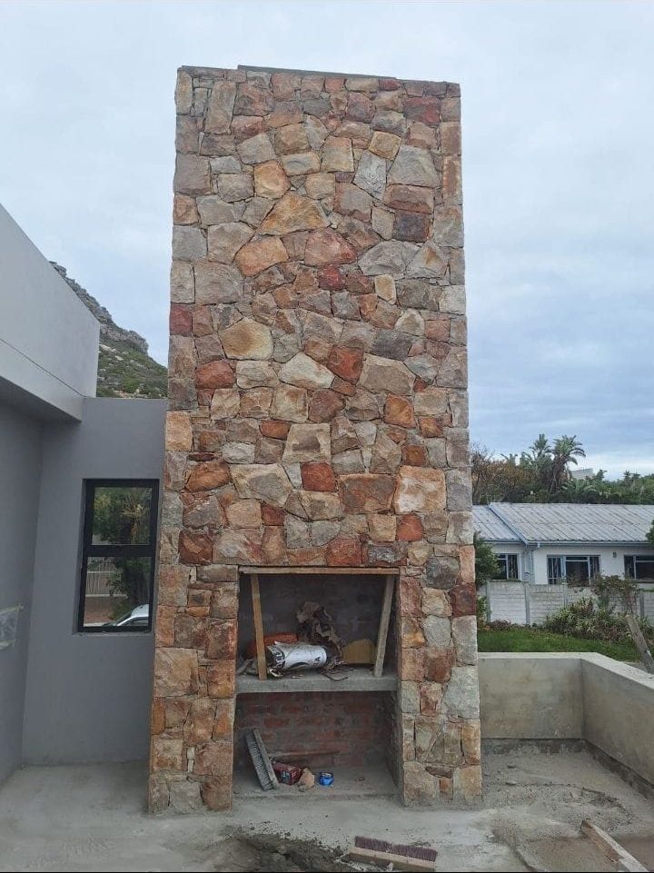 Stone-clad braai and chimney built onto a Cape Town home