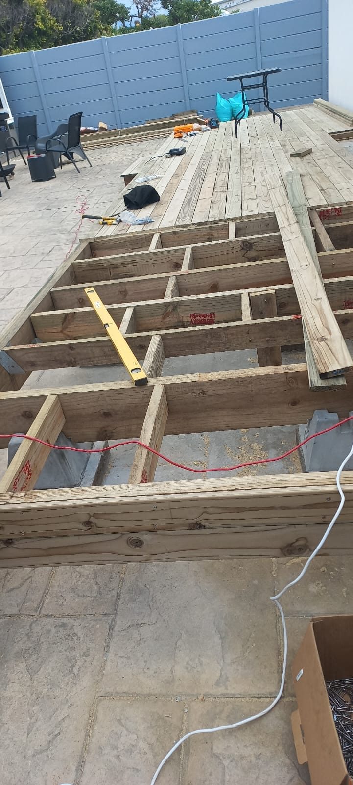 Timber deck substructure being built over an existing patio in Cape Town