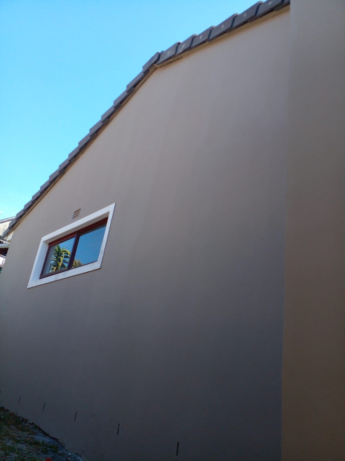 Smooth plastered and freshly painted exterior wall of a Cape Town home